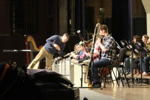 Band director, Tim AuBuchon, working with a student