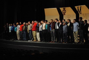 The "Men of Upsilon Phi" sing "Hail Sinfonia" and the chapter hymn. 